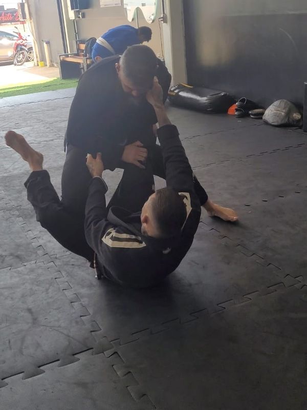 Jiu-jitsu training on the mat: Ed playing guard against a standing partner