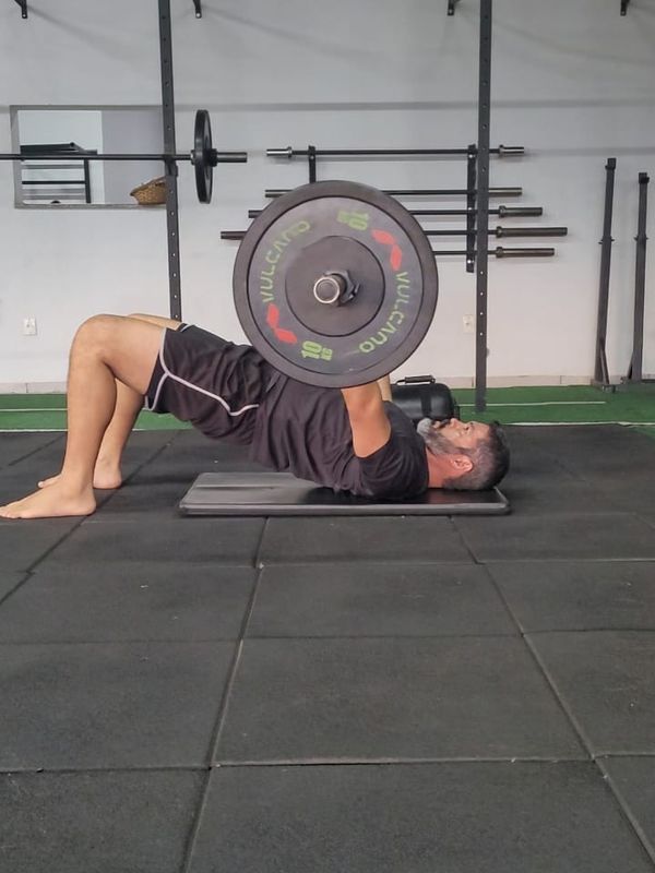 Ed doing a barbell hip thrust at the gym